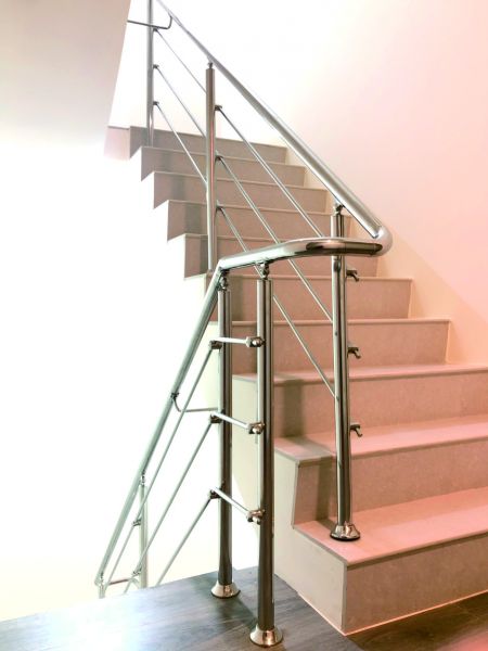 Wood and marble floors with stainless steel rail shuttle stair railings